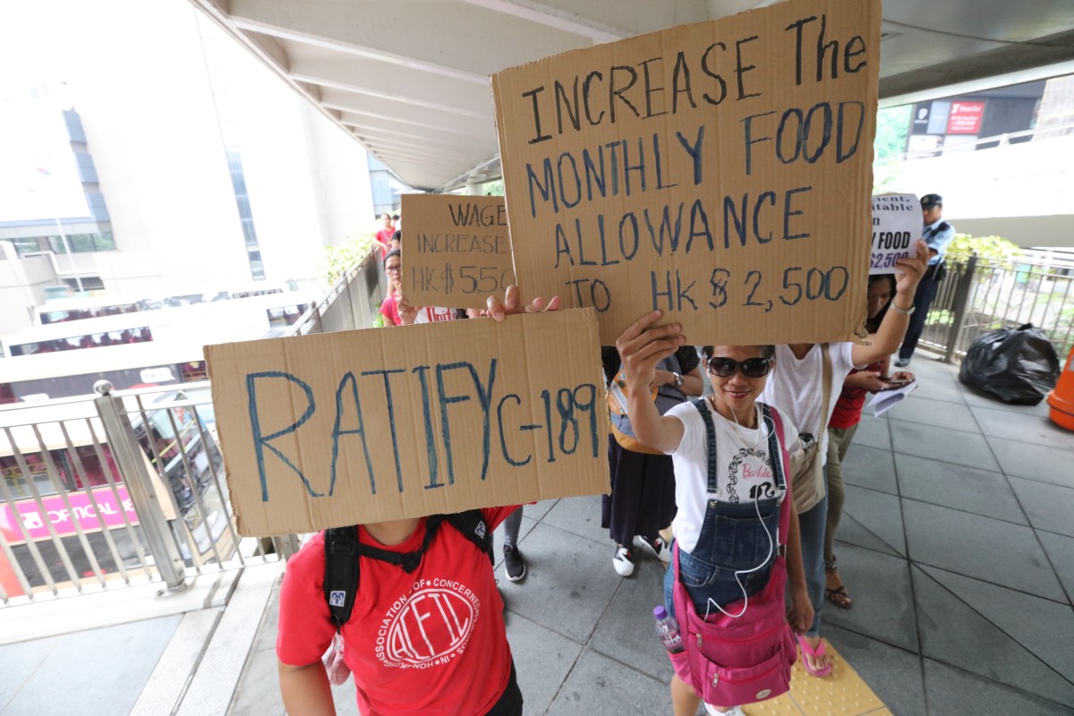 The Asian Migrants' Coordinating Body marches from Exchange Square in Central to the office of Labour Department to campaign for wage increase.