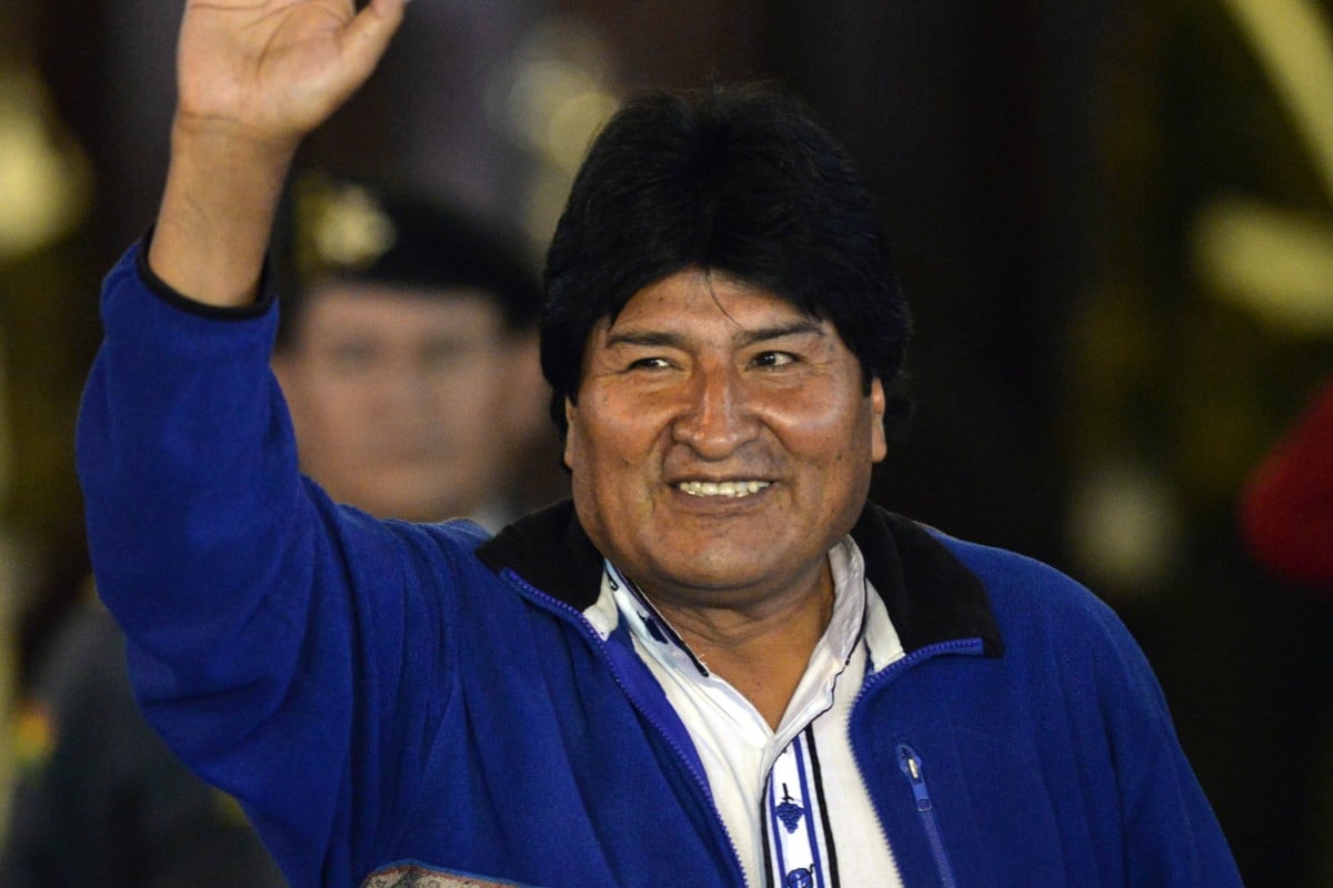Evo Morales salutes his supporters on October 12, 2014