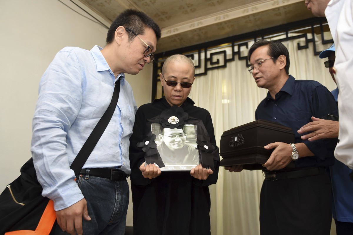 Liu Xia’s (centre) whereabouts are currently unknown.