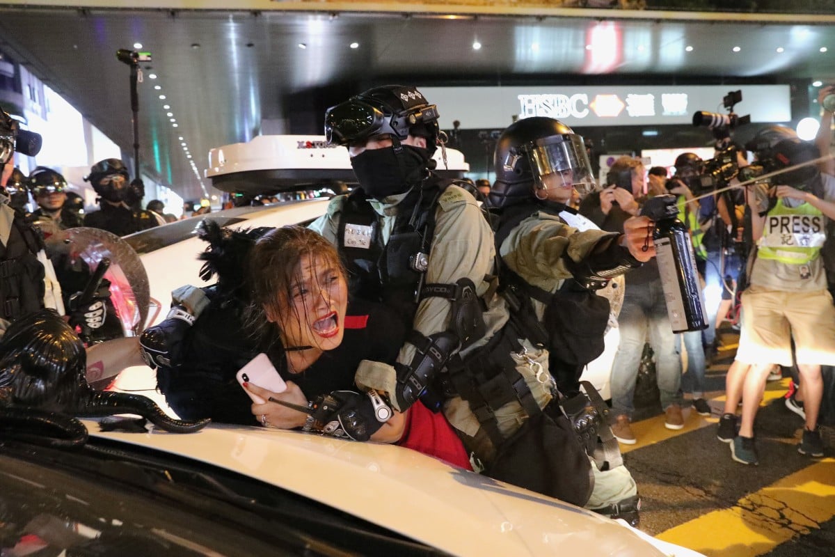 A party-goer is arrested near Lan Kwai Fong in Central on Halloween.