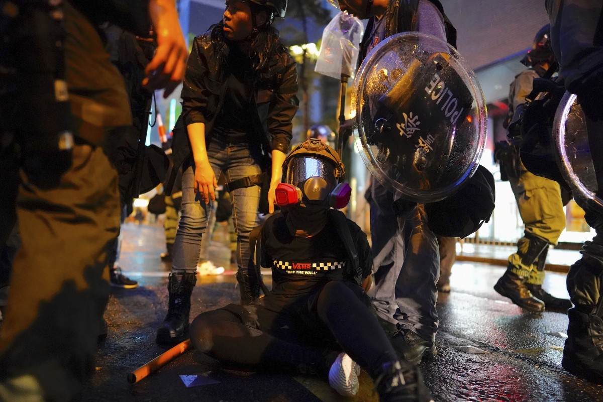 Police arrest a demonstrator during a protest on August 25 in Tsuen Wan.