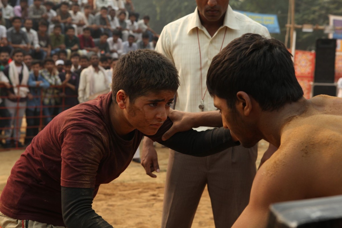 Eldler sister Geeta Phogat faces off against a male opponent in her first wrestling competition.