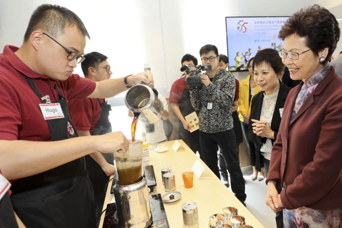hief Executive Carrie Lam Cheng Yuet-ngor (right) visited the Heep Hong Society in Pok Fu Lam in March