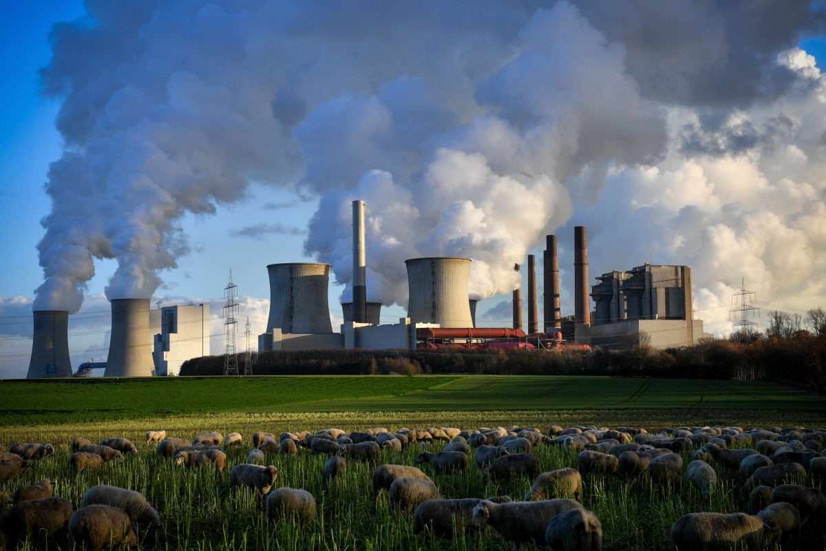Steam rises from a coal-fired power plant in Bergheim, Germany.