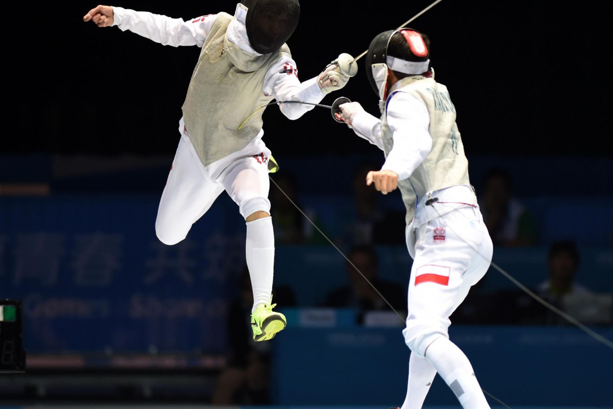 Ryan Choi (left) springs into action at the 2014 Youth Olympic Games in Nanjing, where he won the silver medal.