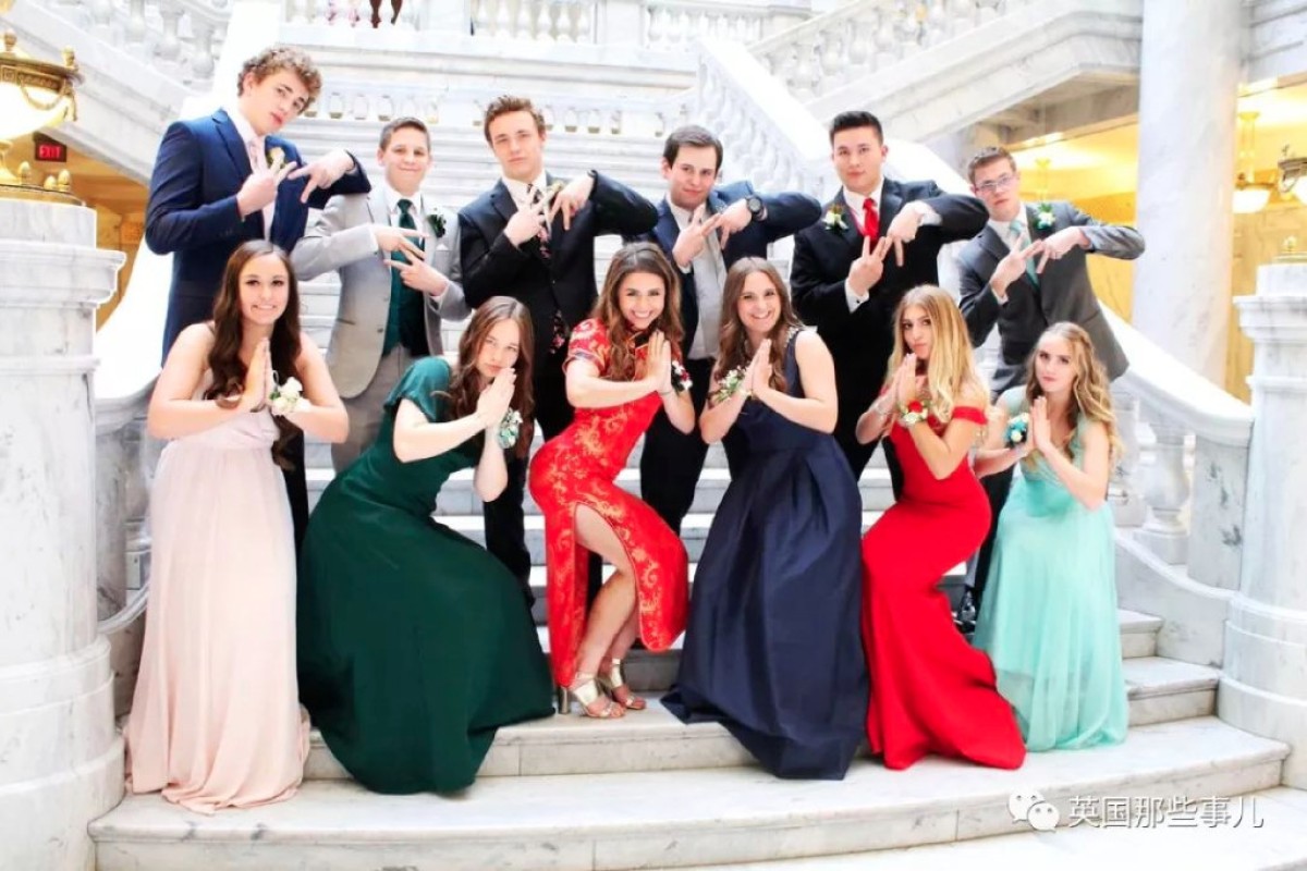 Twitter was divided after an American girl (front row, centre) with no Chinese roots wore a cheongsam to prom.