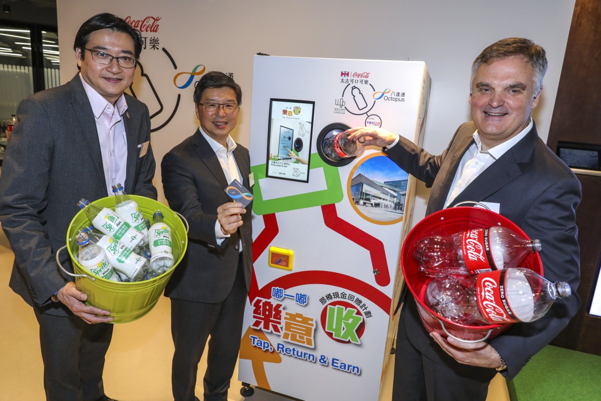 From left, William Yu, chief executive of World Green Organisation, Sunny Cheung, CEO of Octopus Cards, and Neil Waters, executive director at Swire Coca-Cola, at the launch of the reverse vending machines in Hong Kong on Thursday. Photo: May Tse
