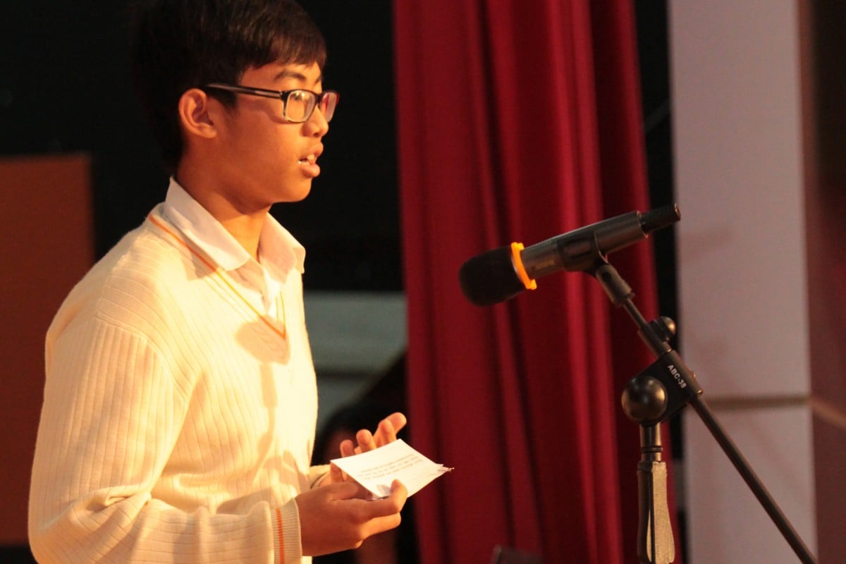 Li Pak-man of HKFYG Lee Shau Kee College speaks at the final of their Inter-house Debate Competition.