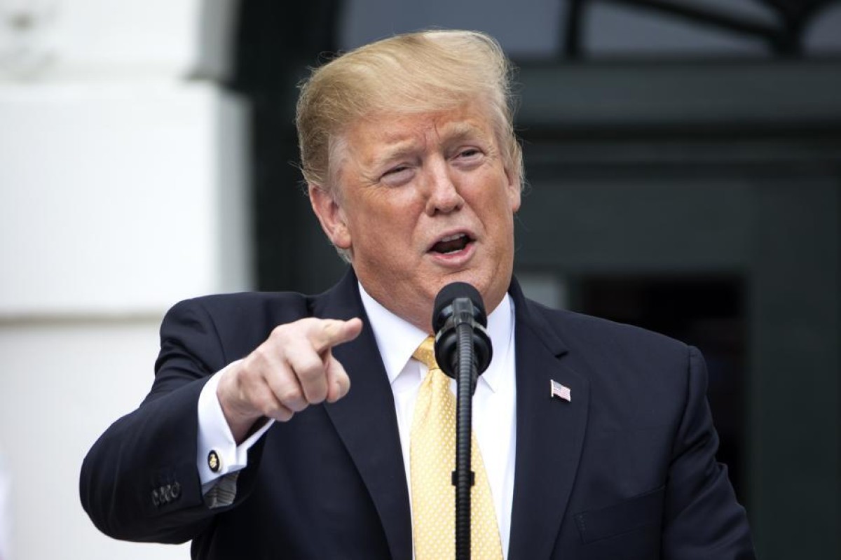 President Trump, seen here at the White House, has accused many news outlets of fake news.