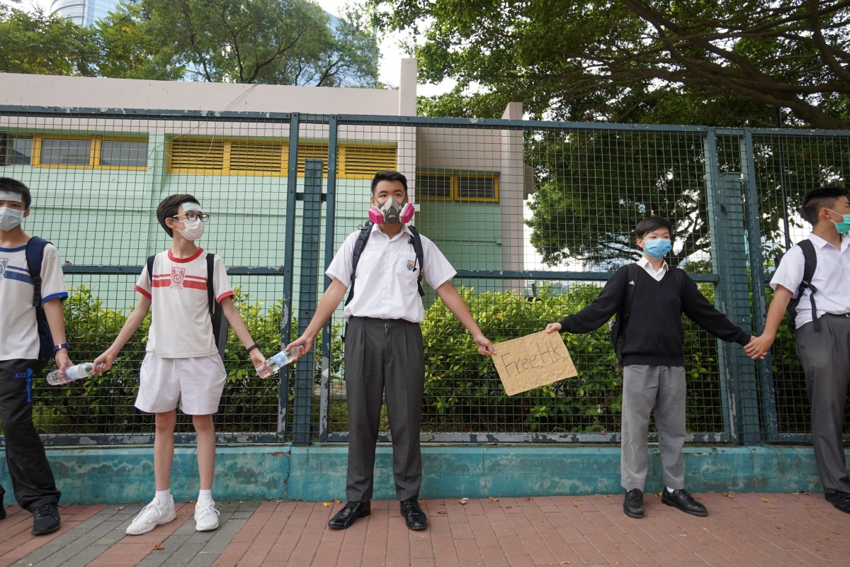 Most participants of the human chain event were masked students, some also wore protest gear like a respirator.