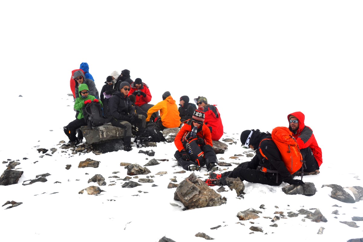The team faced 12-hour hikes and tough weather conditions, but eventually made it to the summit.