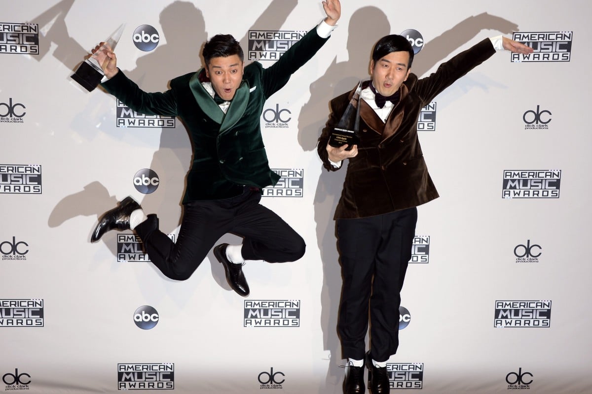 Chopstick Brothers show off their award at the 2014 American Music Awards.