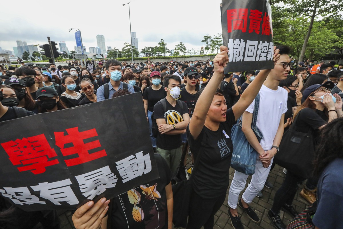 People protest outside the Central Government Offices in Tamar against the extradition bill and calling on city leader to resign