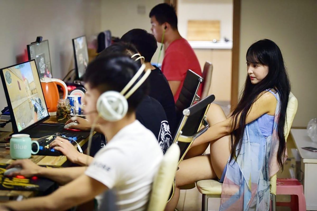 Li Wei, aka e-sports gamer and entrepreneur ViVi keeps an eye on one of her all-male teams.