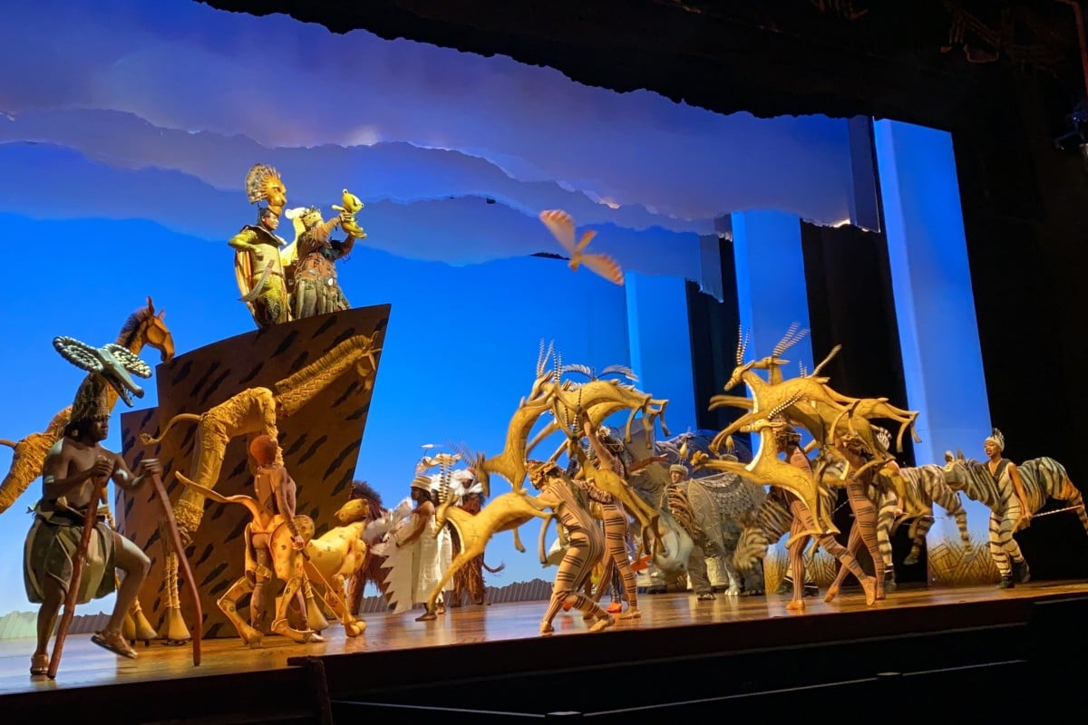 Mufasa and Sarabi shows Simba to other animals in Circle of Life