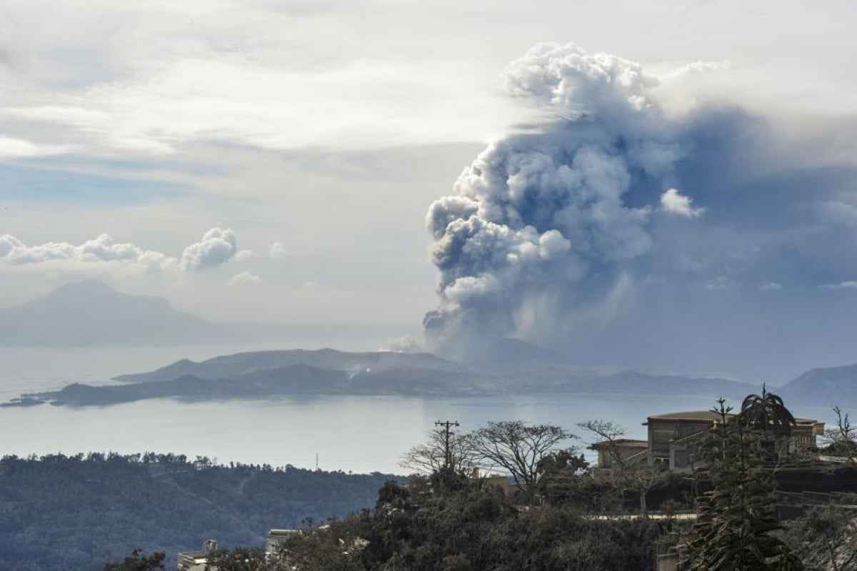 Photo taken on January 13, in Tagaytay, south of Manila, shows fumes billowing from Taal volcano following an eruption the previous day.