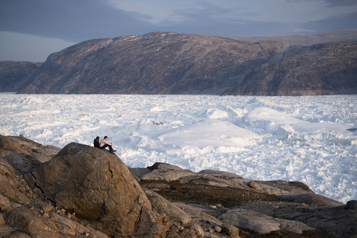 Glaciers are melting as heat reaches record levels. including the pictured Helheim glacier in Greenland.
