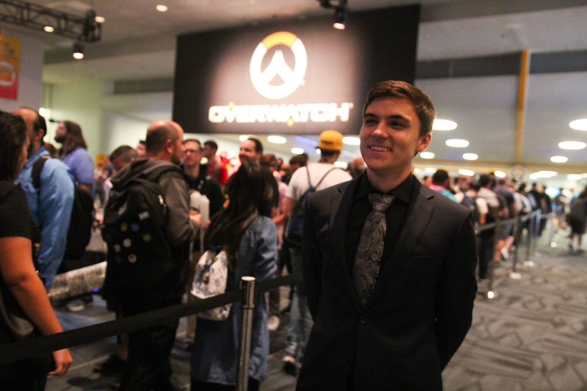 Pro 'Overwatch' player Jake Lyon waits outside a gaming arena to greet eager fans.