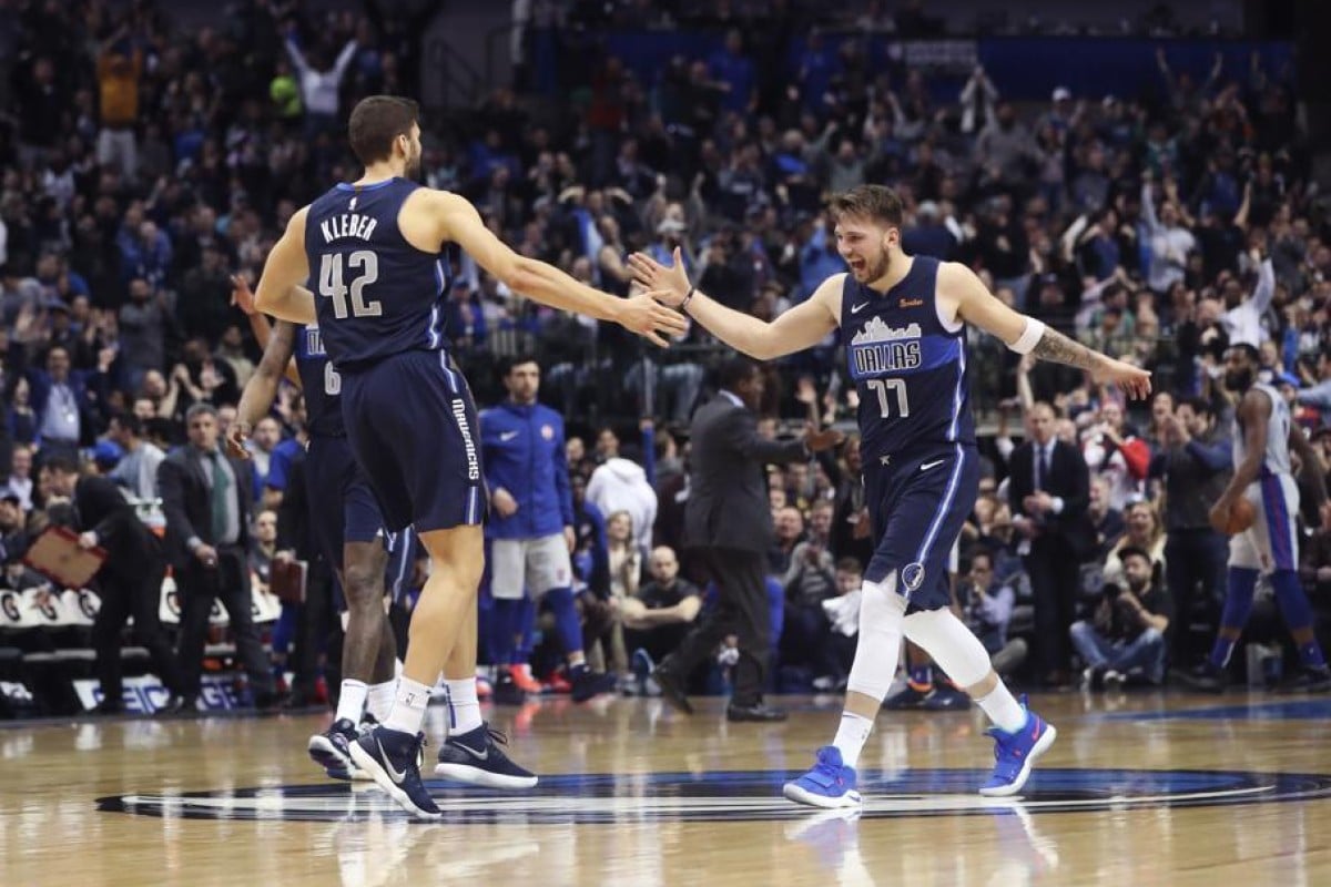 Luka Doncic (right) is averaging more than 20 points, six rebounds, and five assists per game more than halfway through his rookie season.