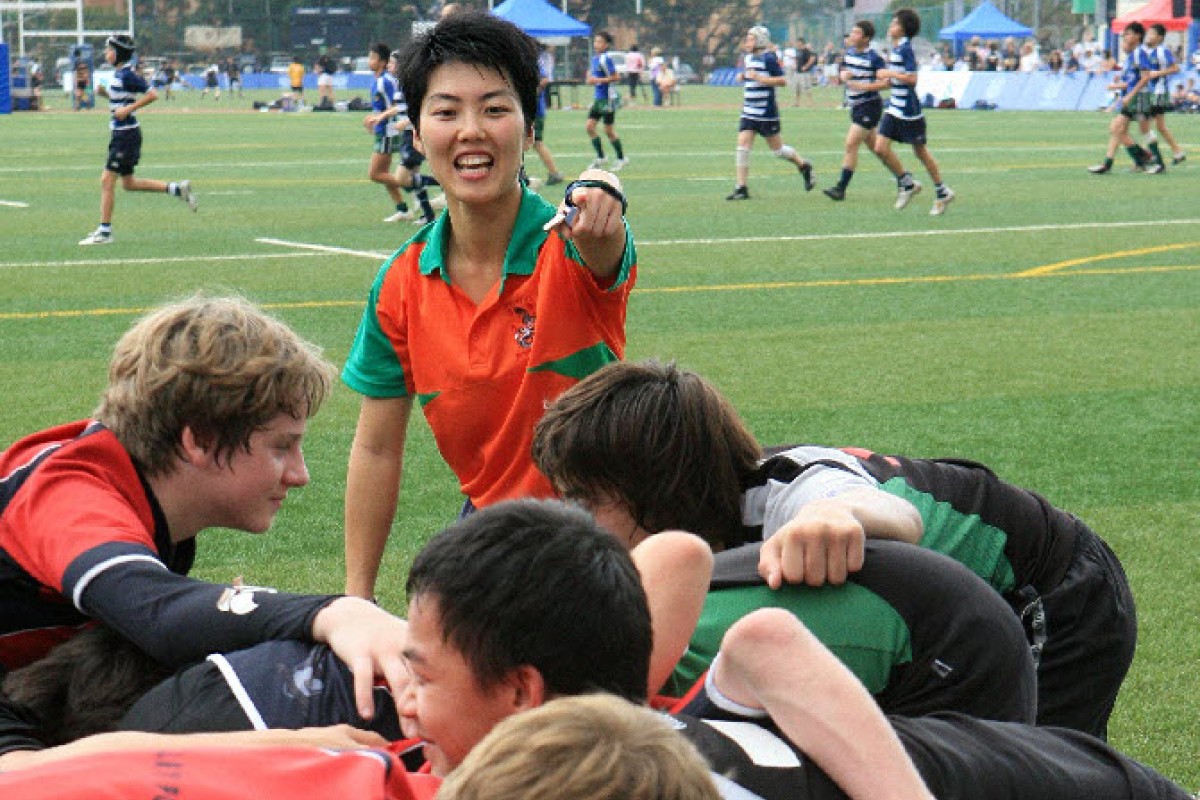 Rugby referee, Gabriel Lee Wing-yi (middle) in action on a rugby match.