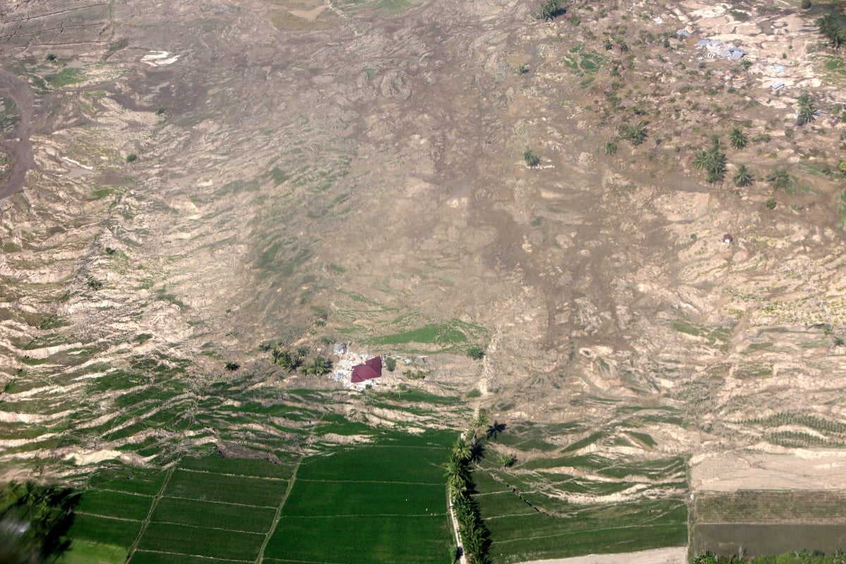 An aerial view of liquefaction, following the earthquake in Palu, Central Sulawesi. The soil makes a wave pattern as it becomes liquid.