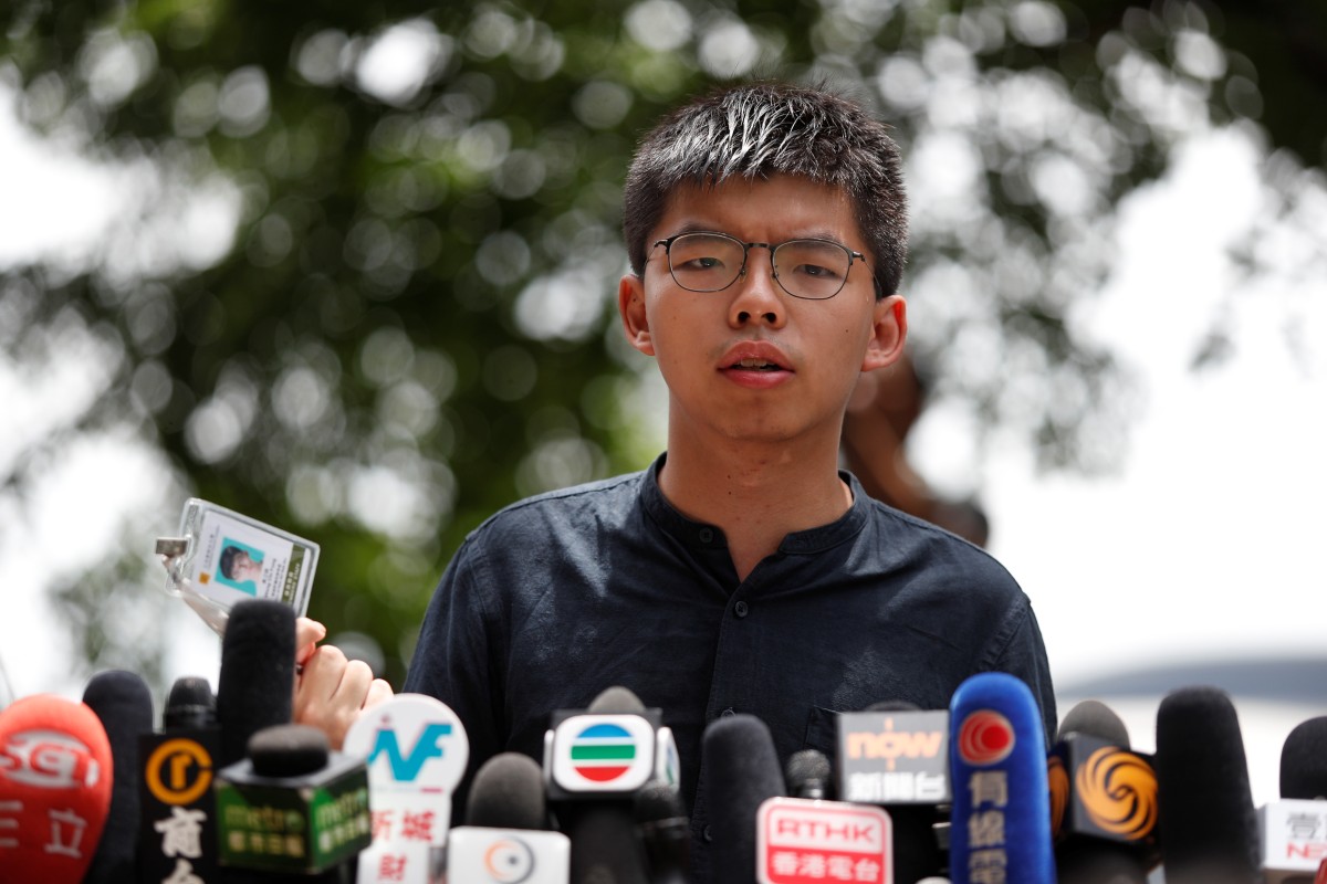Joshua Wong speaks to the world's media outside Hong Kong Legislative Council the day after protesters seized control of the building.