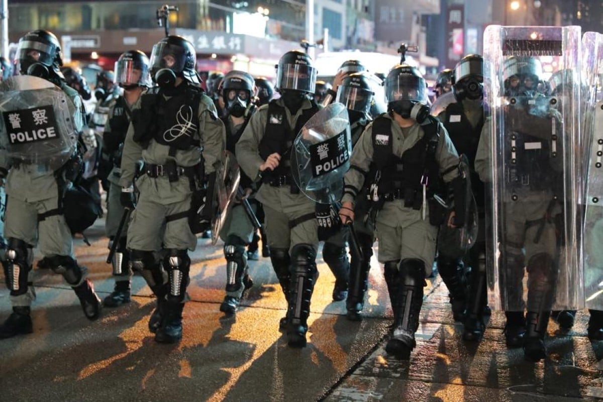 Caught between two worlds, Felix Cheng (not his real name) is both a police officer and an active supporter of the Hong Kong protests.