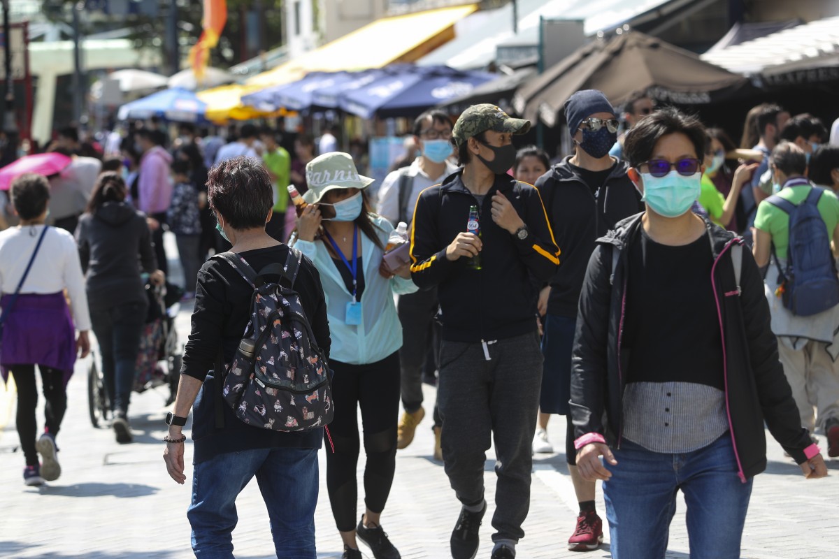 People wearing a face mask enjoying the four-day Easter weekend in Stanley amid the coronavirus outbreak.