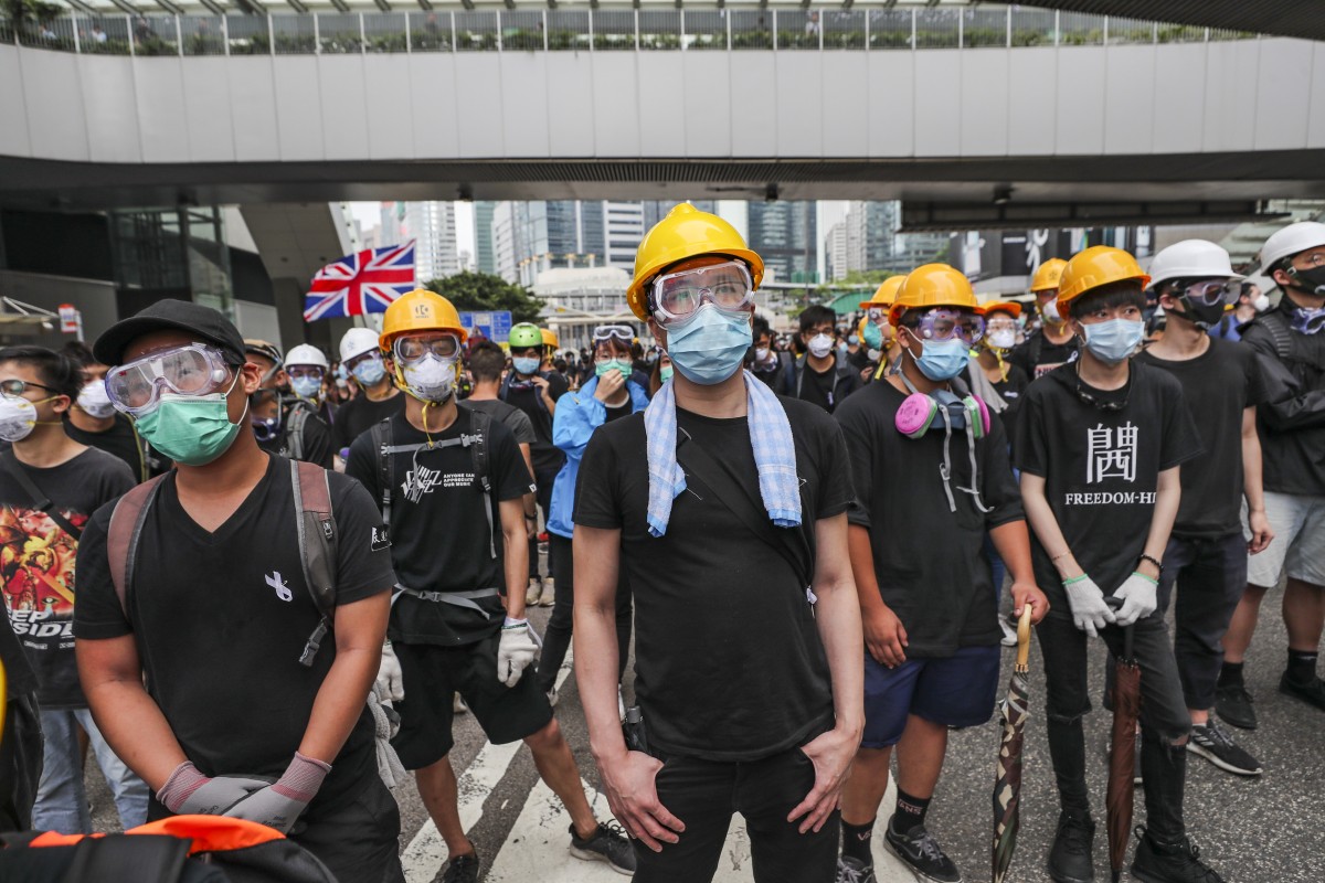 Hong Kong Chief Executive introduced a new law that bans face masks during public assemblies.