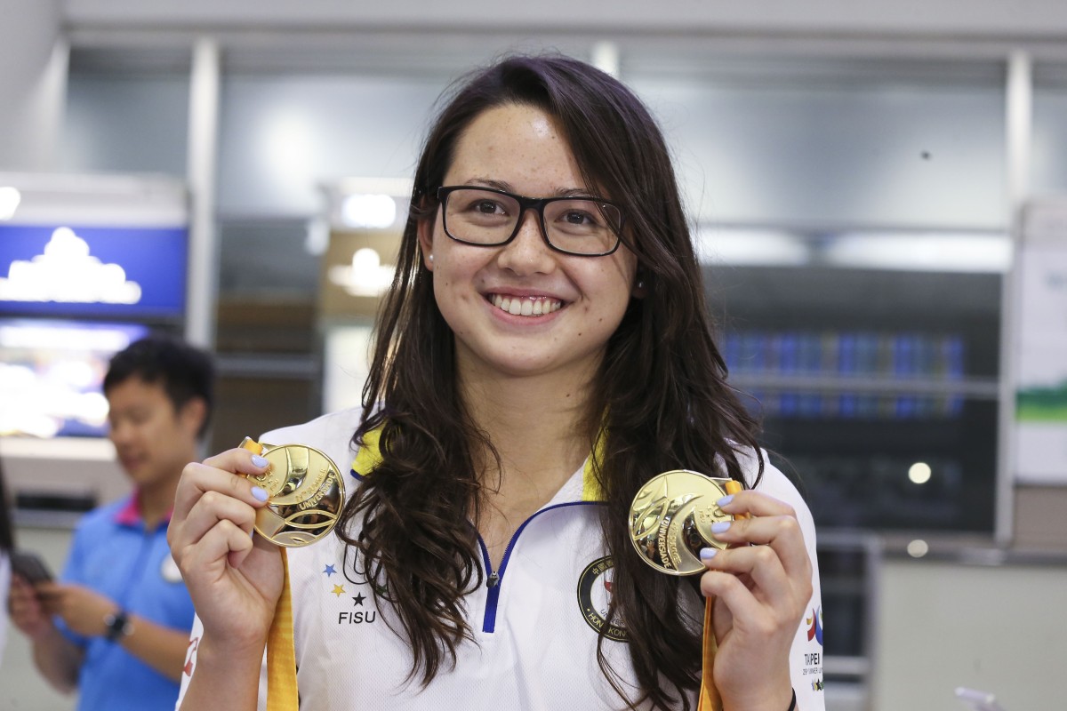 Siobhan Haughey shows off her two World University Games gold medals and her winning smile.