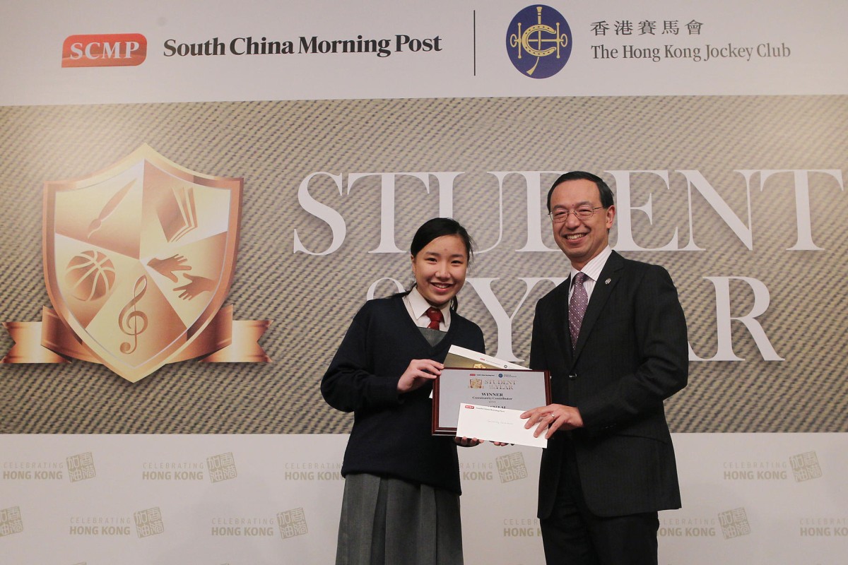 Vanessa Lai receives her South China Morning Post Student of the Year award from the Hong Kong Jockey Club's Kim Mak.