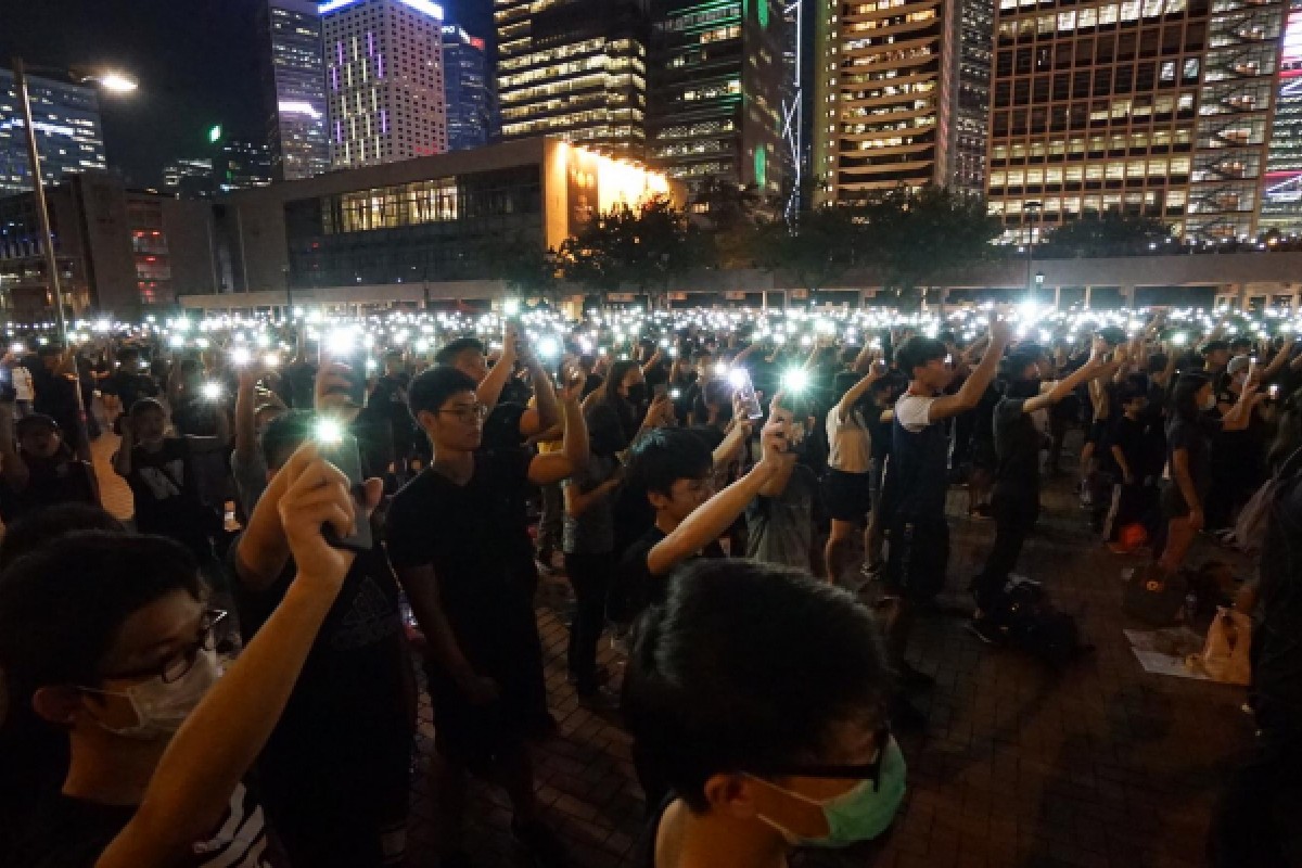 Students held up their phone flashlights as they sang "Do You Hear the People Sing?' together.