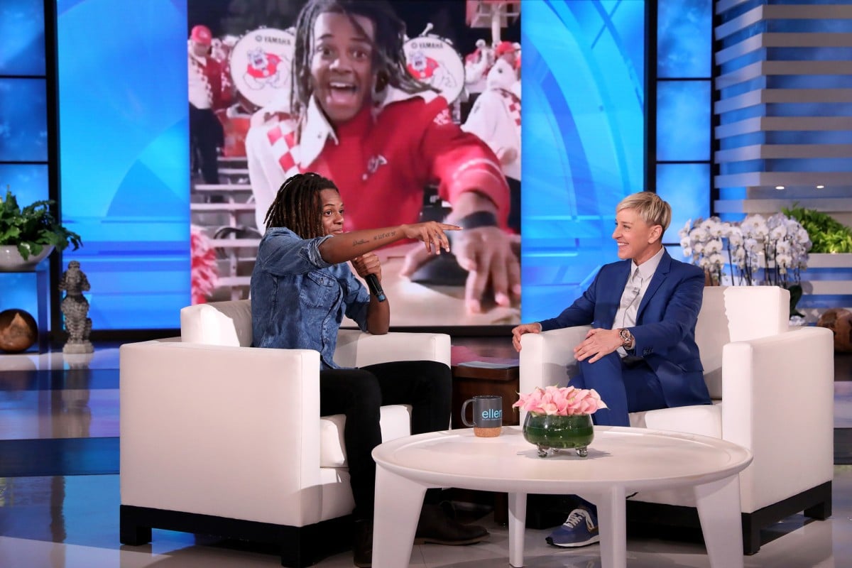 Talk show host Ellen DeGeneres talks with Travis Morris during a taping of “The Ellen DeGeneres Show” in California.
