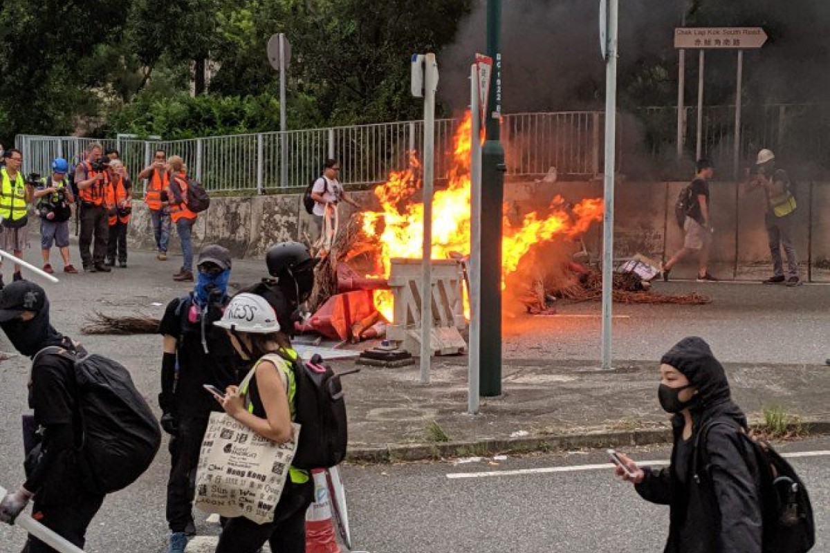 Protesters lit a fire on the bridge between the airport and Tung Chung.