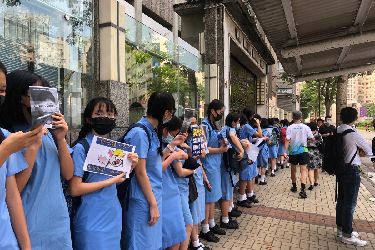 Students from True Light Middle School form a human chain in support of the ongoing call for "5 demands, not one less" in Hong Kong.