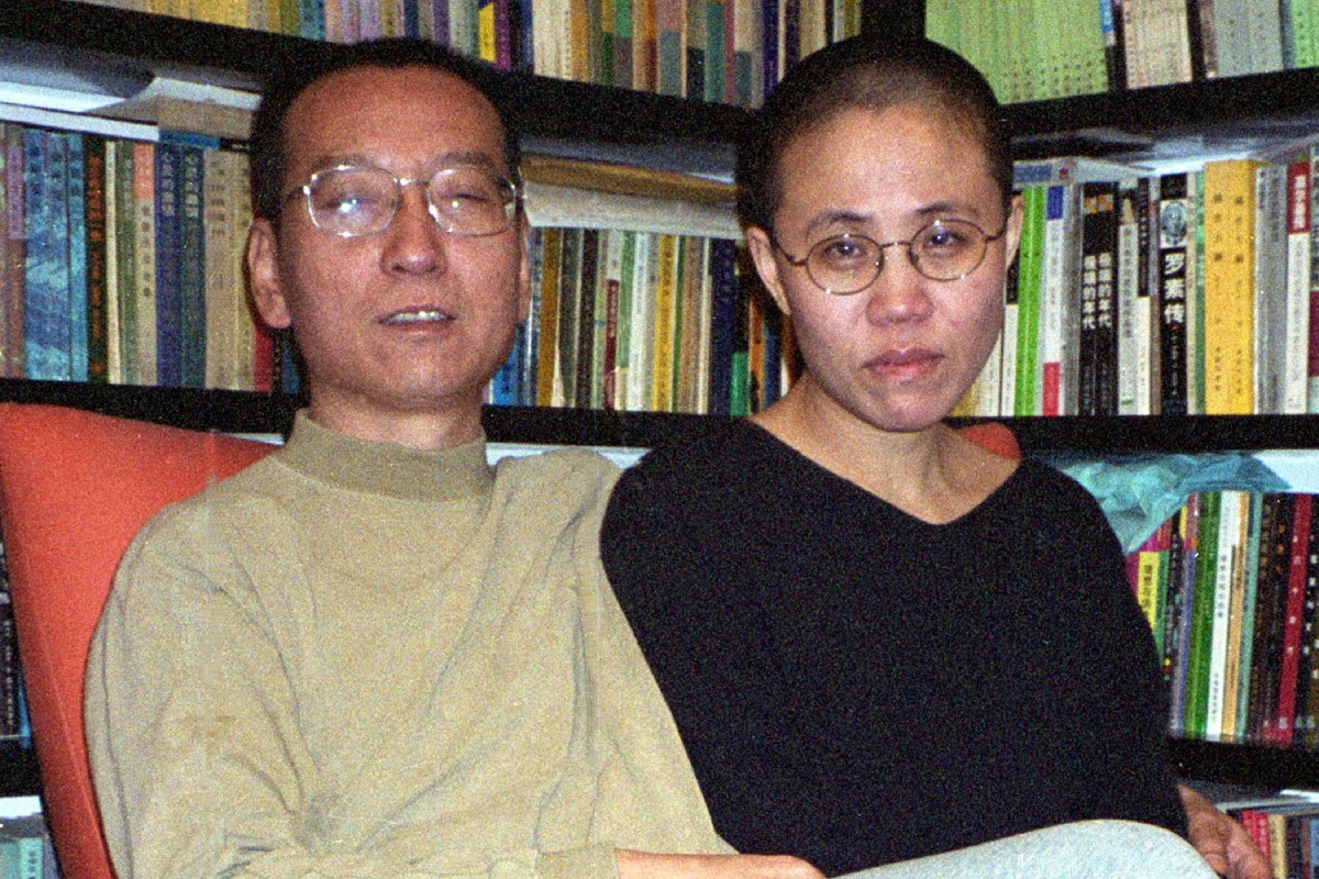 This file handout photo released by the Liu's family and taken on October 22, 2002 shows Chinese dissident and Nobel Peace laureate Liu Xiaobo (L) and his wife Liu Xia in Beijing