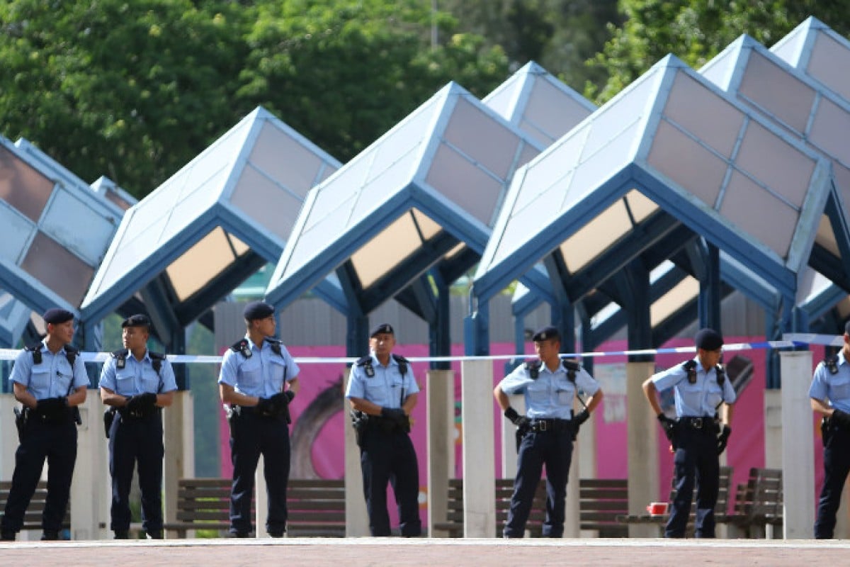 Police at the scene of a shooting in Quarry Bay Park.