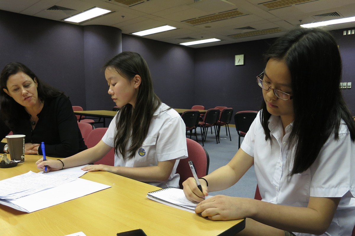 Junior reporters (from left) Vera Ho and Grace Wang interview Australian author Kate Forsyth