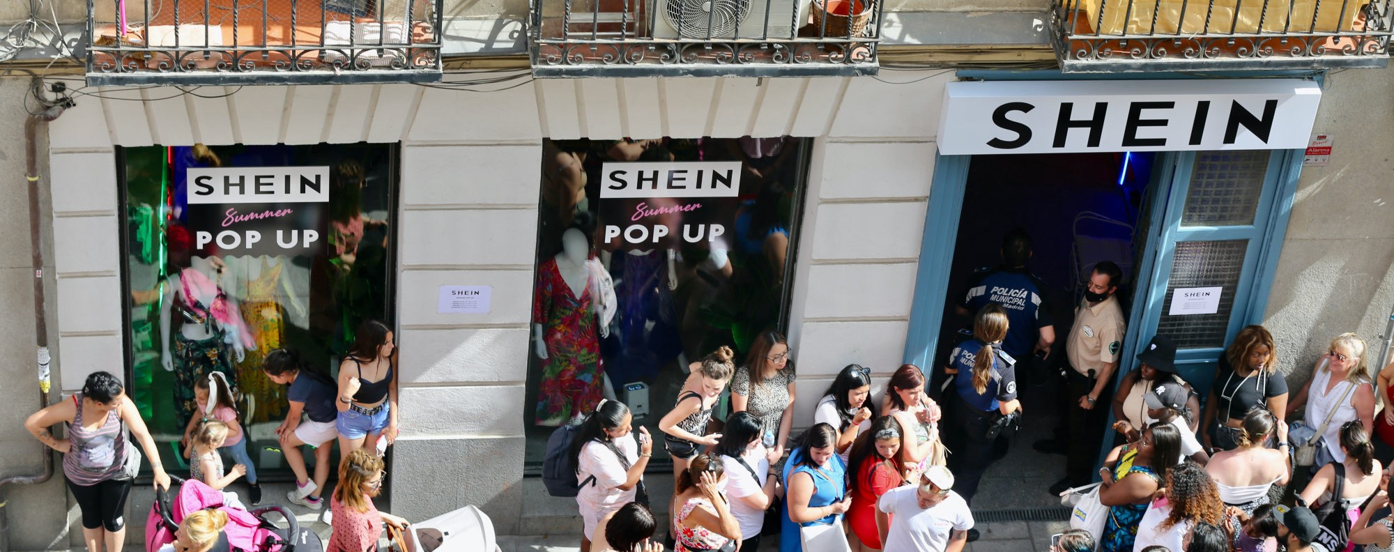 Several people queue to enter SHEIN's first physical store in Madrid, June  2, 2022, in Madrid (Spain). Chinese 'online' fashion brand Shein opens its  first 'pop up store' in Madrid after the