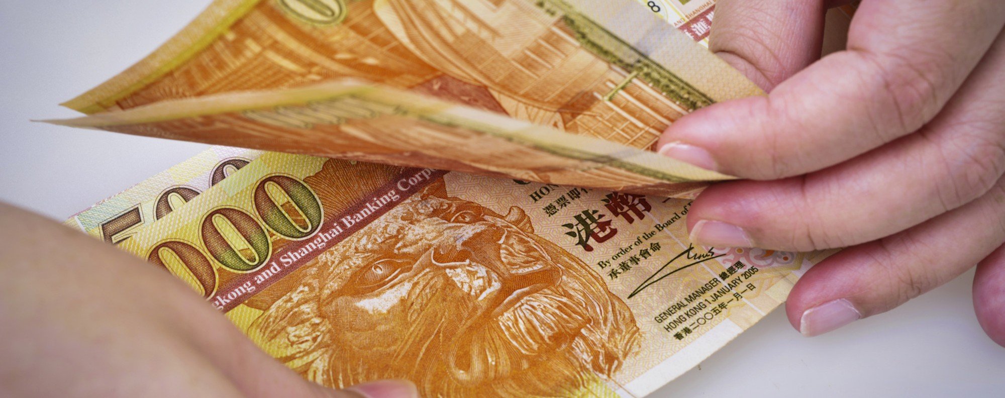 Hong Kong sells US dollars to fight carry trade, defend currency peg |  South China Morning Post