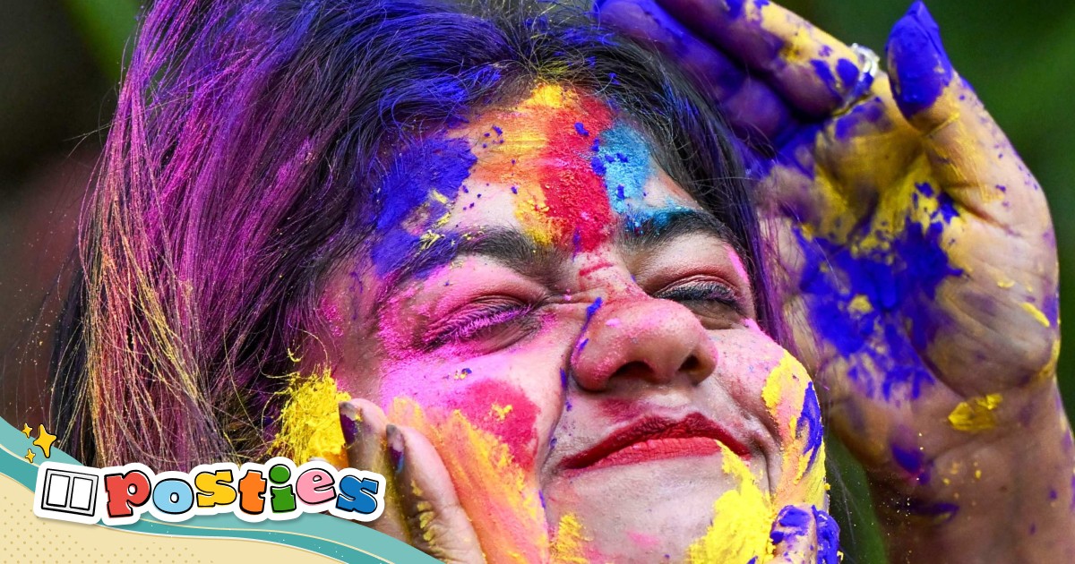 Write a fun caption for this photo of people in India celebrating the colourful festival of Holi - Vimarsana News