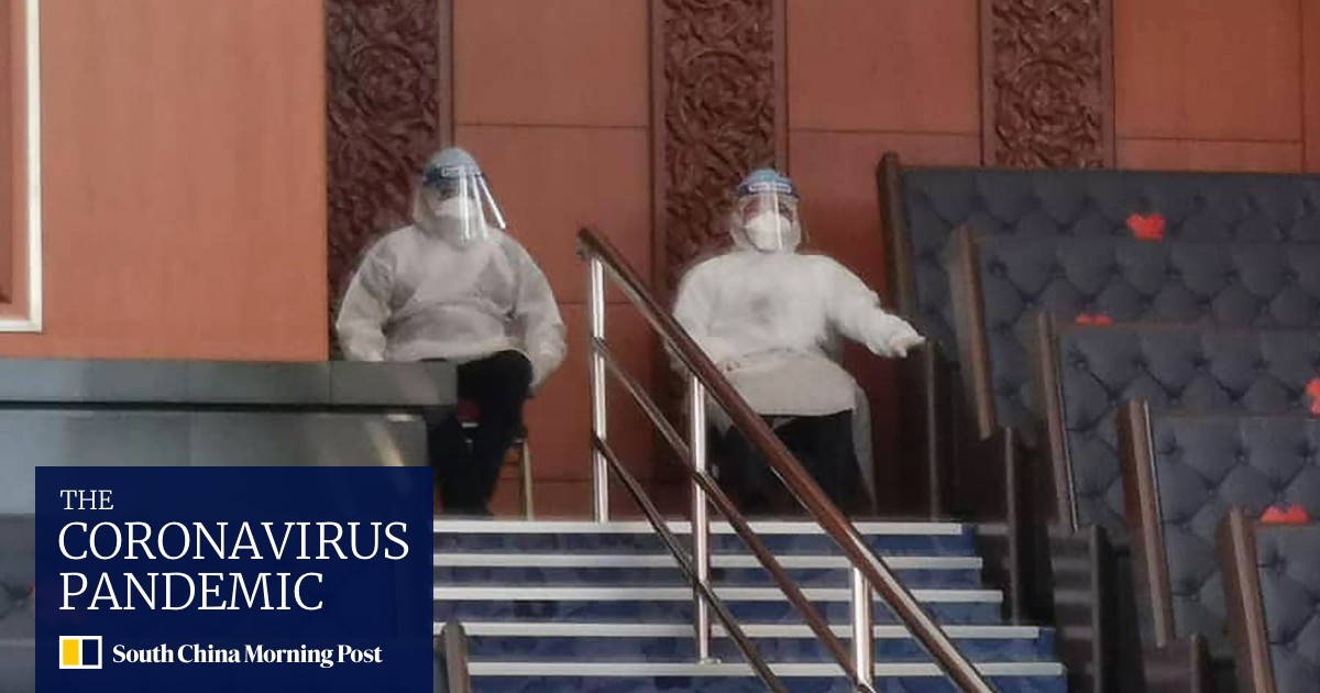 Malaysian ministers enter parliament in PPE, trigger walkout