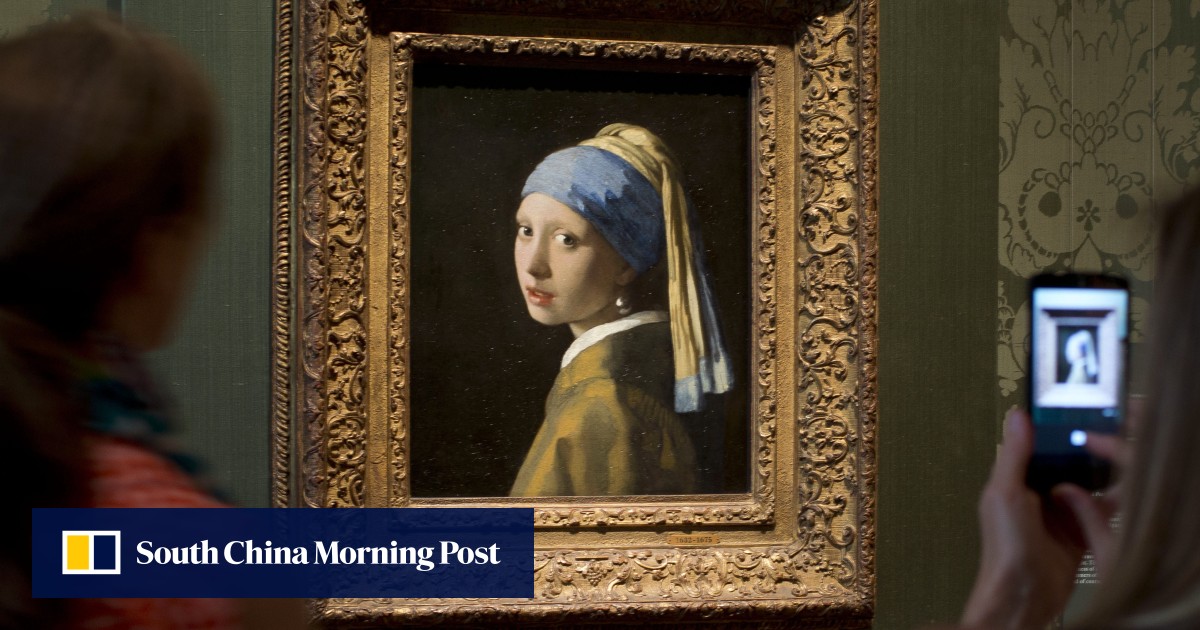 Climate activist glues head to Girl with a Pearl Earring painting