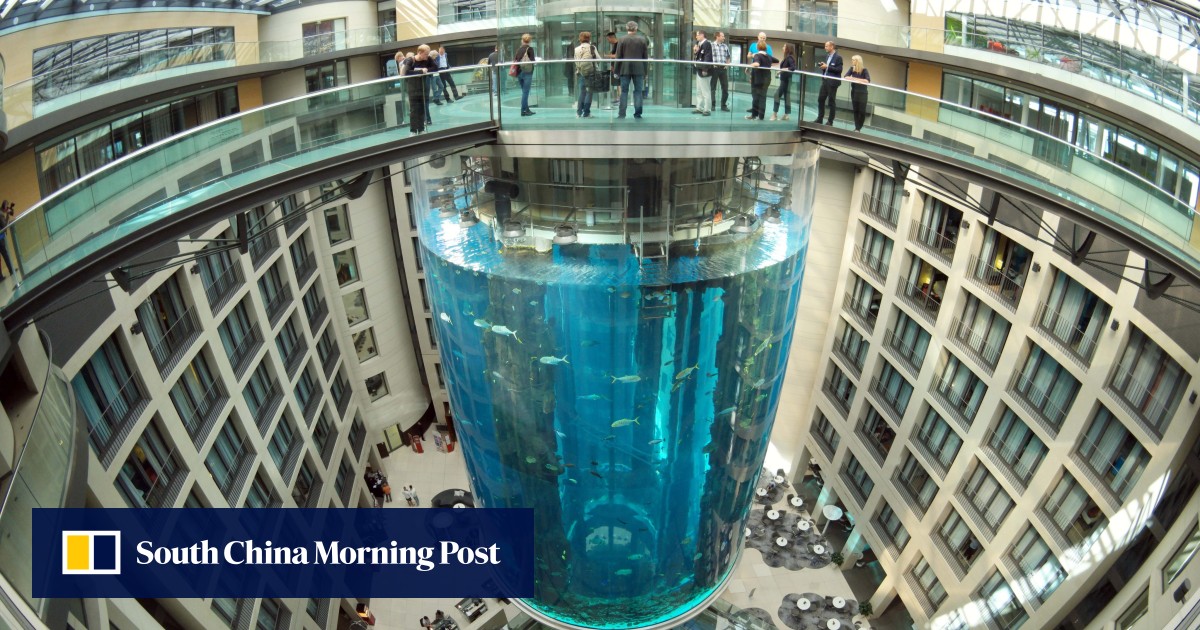 World’s largest freestanding cylindrical aquarium bursts in Berlin
