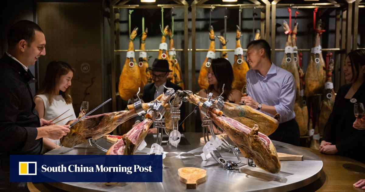 Tapas and a taste, smell and view of cured Iberico hams on warehouse tour