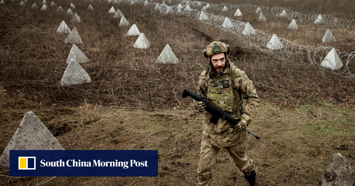 Ukraine builds barricades, digs trenches as focus shifts to defence against Russian forces
