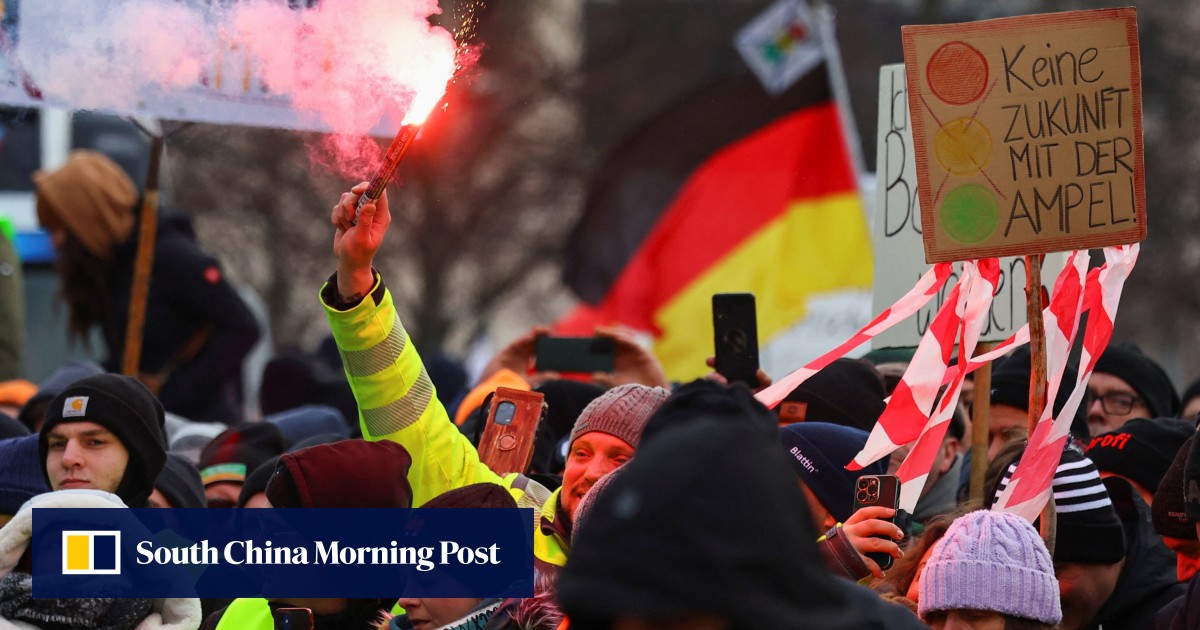 German farmers drive tractors into Berlin to protest fuel subsidy cuts: ‘government must resign’