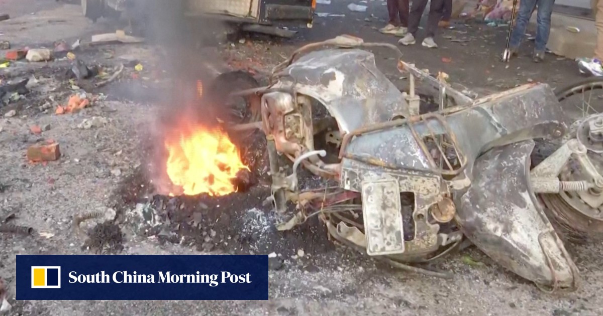 India town sets curfew, orders police to shoot violators after fatal clashes over mosque