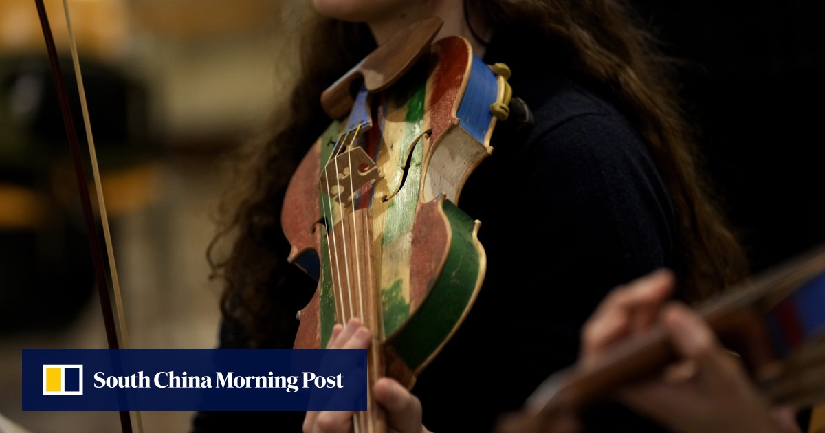 Violins, cellos and violas made by prisoners from wood recovered from people smugglers’ boats take their bow in La Scala concert