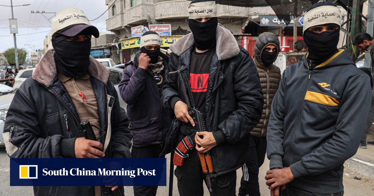 With police absent in war-torn Gaza, masked vigilantes patrol streets